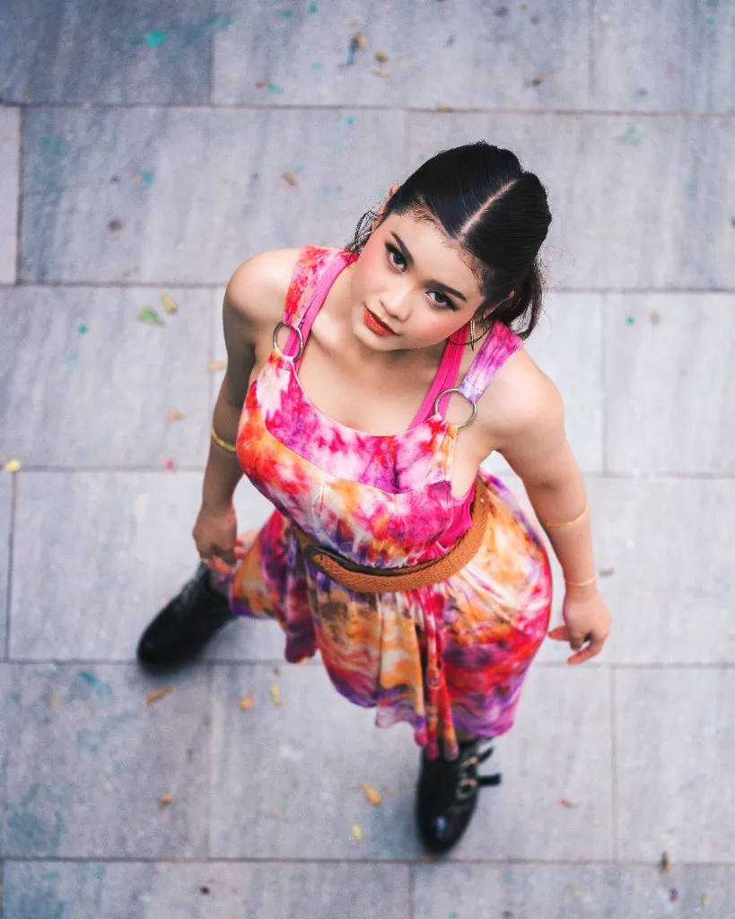 Model in a colorful dress photographed from above
